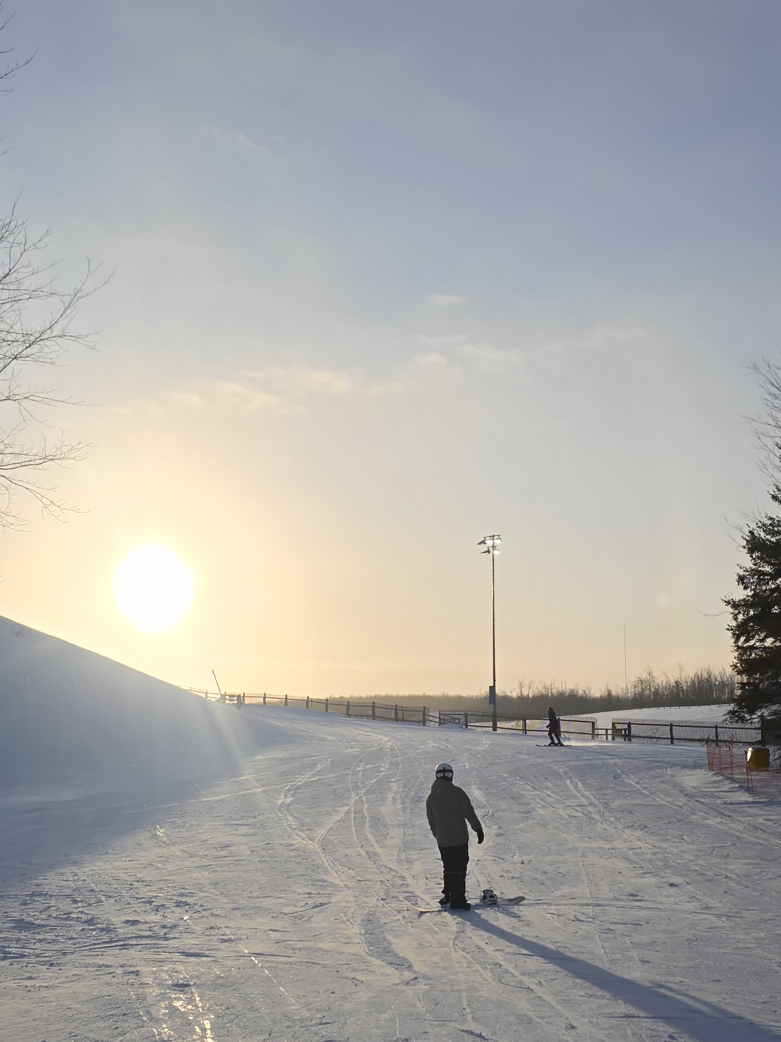 Snowboarding during sunset